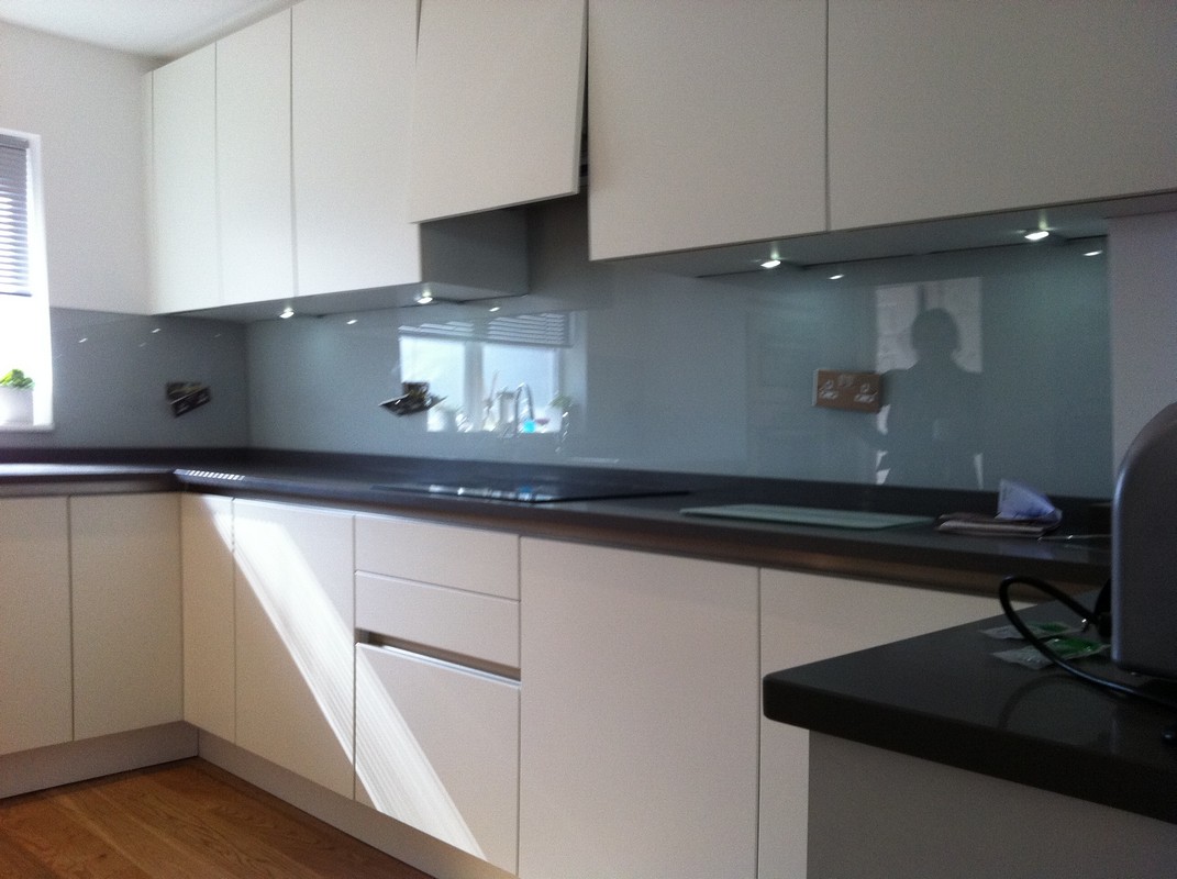 Grey glass kitchen splashback with LED lighting in Wandsworth
