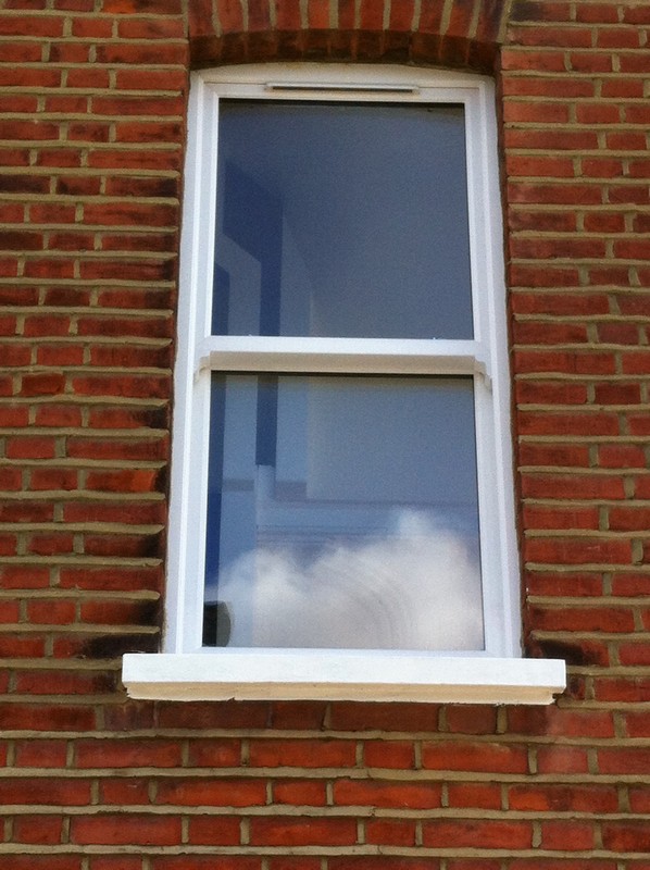 uPVC sash window on Victorian red brick house in Wandsworth
